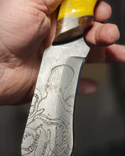 Carregar imagem no visualizador da galeria, Kraken Hybrid Yellow Epoxy Burl Handle Engraved High Carbon Steel Recurved Clip Point Blade
